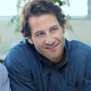 Couple talking to financial adviser