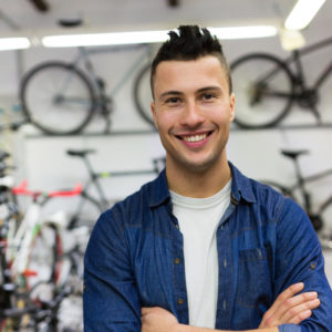 Owner in bicycle shop