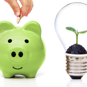 Ethical investing - piggy bank with lightbulb with plant sprouting inside