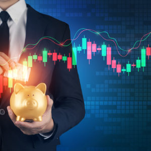 Businessman saving in investment candlestick graph -representing tracking superannuation