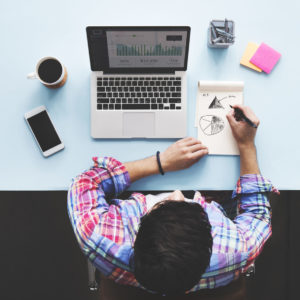 Man sitting at computer working on his small business