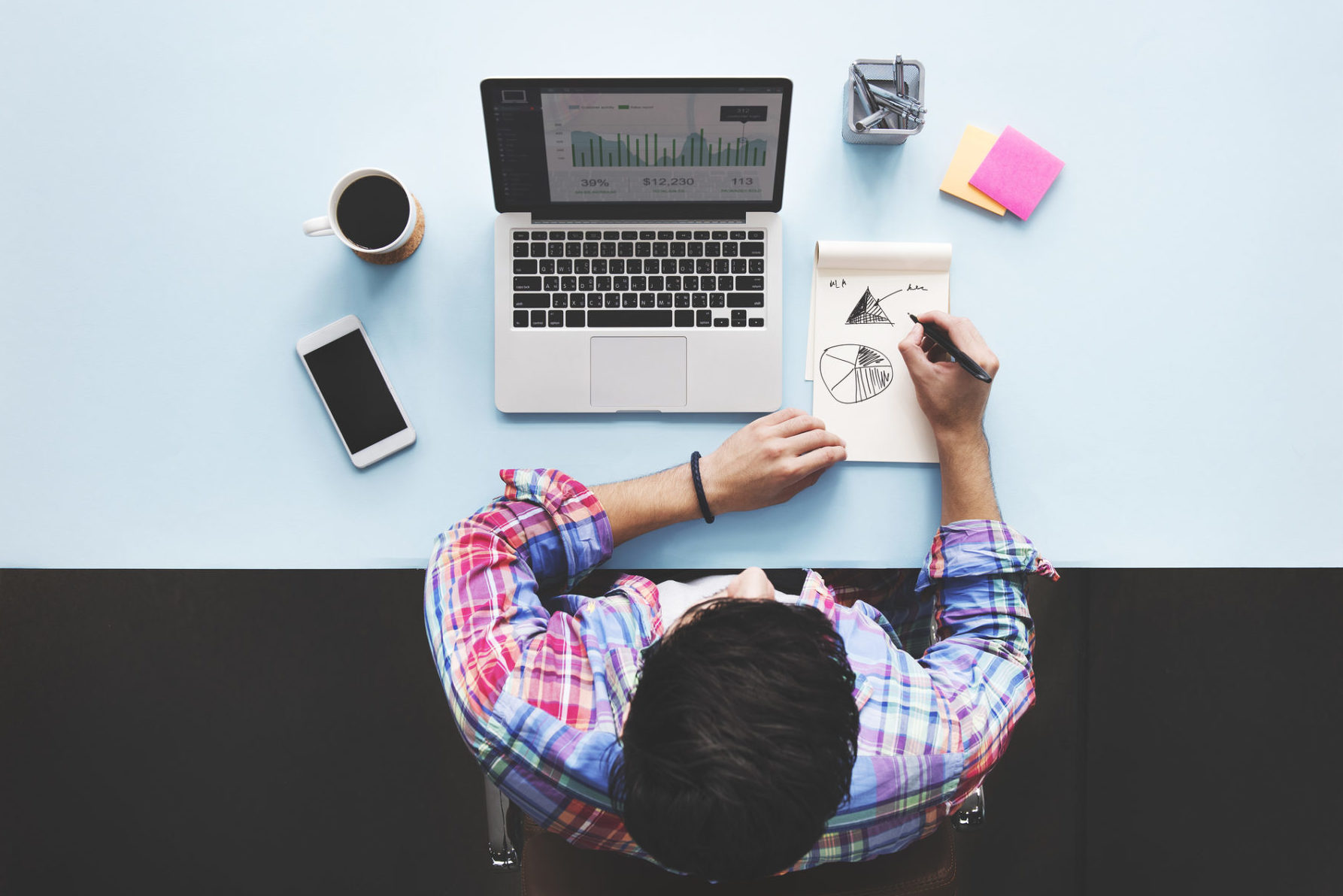 Man sitting at computer working on his small business