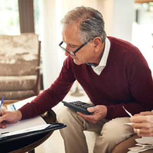 Senior couple discussing how to save money after retirement