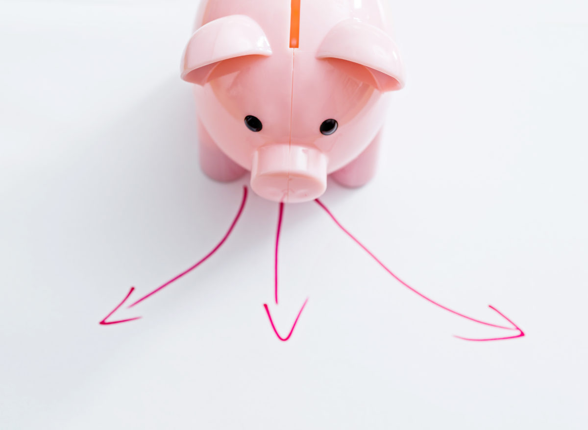 Small piggy bank standing in front of three arrows showing choice of super funds